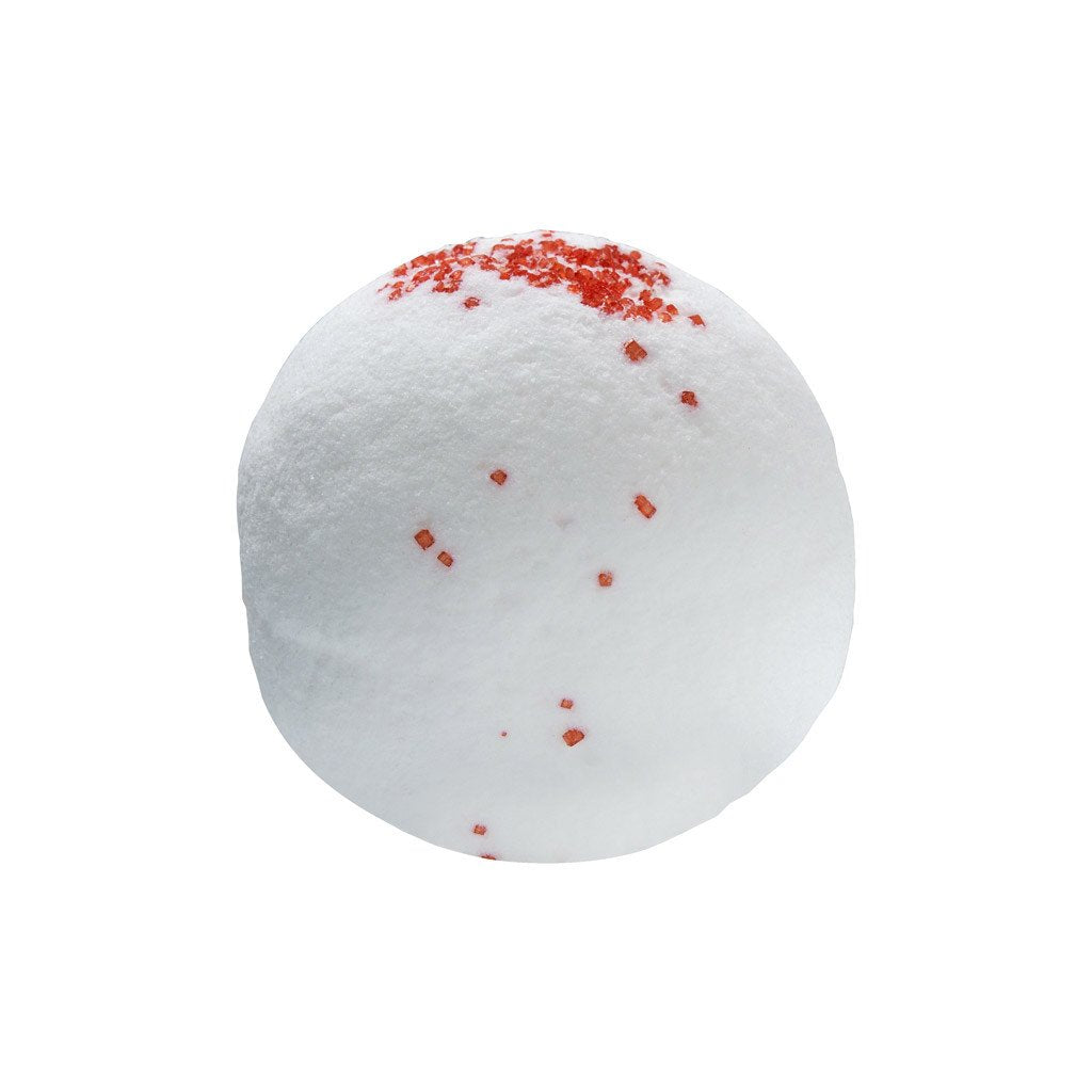 Flat lay image of Cranberry Bath Bomb on a white background. Bath bomb is round and white in colour with red sprinkles gathered at the top and a few coming down the front center. 